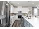 Bright modern kitchen with stainless steel refrigerator and island with sink at 2715 Stream Valley Lane Nw Nw Cir, Atlanta, GA 30318