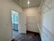 Walk-in closet with white wire shelving, providing plenty of storage space, leading to the bathroom at 2715 Stream Valley Lane Nw Nw Cir, Atlanta, GA 30318