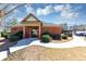 Charming brick clubhouse with a welcoming entrance, surrounded by manicured landscaping and ample parking at 805 Pleasant Hill Nw Rd # 343, Lilburn, GA 30047