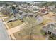 Aerial view of a residential area with homes, driveways, landscaping and tree lined streets at 9109 Alden Dr, Locust Grove, GA 30248