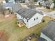 Aerial view of the home with siding, a covered patio, and a spacious grassy backyard at 9109 Alden Dr, Locust Grove, GA 30248