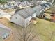 Aerial view of backyard and siding of the home, showcasing the grassy yard and neighborhood surroundings at 9109 Alden Dr, Locust Grove, GA 30248