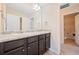 Bathroom features a double vanity and easy access to a closet and other rooms at 9109 Alden Dr, Locust Grove, GA 30248