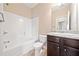 Bathroom featuring a tub and shower, a vanity with a granite countertop at 9109 Alden Dr, Locust Grove, GA 30248
