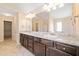 Bathroom boasts double vanity with decorative countertop and ample cabinet storage at 9109 Alden Dr, Locust Grove, GA 30248