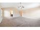 Large bedroom with neutral carpet and ensuite bath provides a private retreat at 9109 Alden Dr, Locust Grove, GA 30248