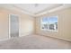 Bright bedroom with walk-in closet and large window offering neighborhood views at 9109 Alden Dr, Locust Grove, GA 30248