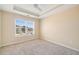 Cozy bedroom with large window, carpet, and ceiling fan at 9109 Alden Dr, Locust Grove, GA 30248