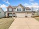 Charming two-story home with a three-car garage and well-maintained lawn at 9109 Alden Dr, Locust Grove, GA 30248