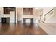 Open-concept living space featuring hardwood floors and a built-in desk at 9109 Alden Dr, Locust Grove, GA 30248