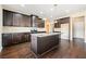 This kitchen features stainless steel appliances, granite countertops and a center island at 9109 Alden Dr, Locust Grove, GA 30248