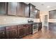 Kitchen featuring stainless steel appliances, granite countertops, and ample cabinet space at 9109 Alden Dr, Locust Grove, GA 30248
