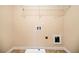 The laundry room offers a sink, connections for a washer and dryer, and shelving at 9109 Alden Dr, Locust Grove, GA 30248