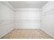 Large walk-in closet with adjustable wire shelving is the perfect storage solution at 9109 Alden Dr, Locust Grove, GA 30248
