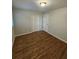Bedroom with hardwood floors, neutral color palette, and closet for storage at 2681 Aquamist Dr, Decatur, GA 30034