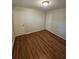 Bedroom with hardwood floors, neutral color palette, and doors for easy access at 2681 Aquamist Dr, Decatur, GA 30034