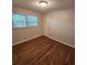 Bedroom featuring natural light from two windows and hardwood floors at 2681 Aquamist Dr, Decatur, GA 30034