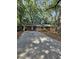 Charming single-story home featuring a long driveway, beautiful mature trees, and a classic brick exterior at 2681 Aquamist Dr, Decatur, GA 30034