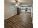 Bright kitchen with stainless steel appliances, white cabinets, and luxury vinyl plank flooring at 2681 Aquamist Dr, Decatur, GA 30034