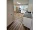 Modern kitchen with stainless steel appliances, granite countertops, white cabinets, and luxury vinyl flooring at 2681 Aquamist Dr, Decatur, GA 30034