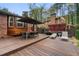 Relaxing backyard deck with outdoor dining area, lounge chairs, and a privacy fence at 3504 Palace Ct, Tucker, GA 30084