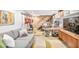 Finished basement featuring a gray couch and wall-mounted guitars, perfect for entertainment or relaxation at 3504 Palace Ct, Tucker, GA 30084