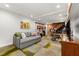 Finished basement with cozy seating, a work space, and guitars displayed along the wall at 3504 Palace Ct, Tucker, GA 30084