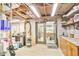 Unfinished basement featuring work area with table, storage shelves, and doors to adjacent area at 3504 Palace Ct, Tucker, GA 30084