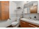 Modern bathroom with wood vanity, tiled walls, and stylish fixtures at 3504 Palace Ct, Tucker, GA 30084