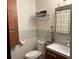 Modern bathroom features a vanity with storage, toilet, and towel rack at 3504 Palace Ct, Tucker, GA 30084