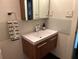 Stylish bathroom with modern vanity, sleek fixtures, and decorative mosaic tile backsplash at 3504 Palace Ct, Tucker, GA 30084