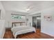 Cozy bedroom with a bed, natural light, ceiling fan, and sliding door closet at 3504 Palace Ct, Tucker, GA 30084