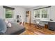 Cozy bedroom with desk, built-in shelving, and large windows that bring the outdoors in at 3504 Palace Ct, Tucker, GA 30084
