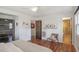 Bedroom featuring hardwood floors, a sliding door closet, and a bright bathroom at 3504 Palace Ct, Tucker, GA 30084