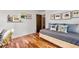 Neutral bedroom with hardwood floors, trundle daybed, and modern art providing a calm space to relax at 3504 Palace Ct, Tucker, GA 30084