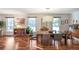 Dining area with natural light, hardwood floors, and stylish furnishings at 3504 Palace Ct, Tucker, GA 30084