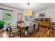 Bright dining room featuring hardwood floors, modern lighting, and stylish furniture at 3504 Palace Ct, Tucker, GA 30084