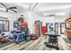 Spacious garage equipped with ceiling fans, work tables and storage shelves perfect for hobbies and projects at 3504 Palace Ct, Tucker, GA 30084