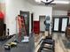 Well-lit garage space featuring ample work tables and storage shelves perfect for hobbies and projects at 3504 Palace Ct, Tucker, GA 30084