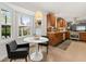 Well-lit kitchen features stainless steel appliances, granite countertops, and breakfast nook at 3504 Palace Ct, Tucker, GA 30084