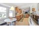 Bright kitchen with stainless appliances, hardwood cabinets, and an adjacent breakfast nook with large windows at 3504 Palace Ct, Tucker, GA 30084