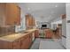 Well-lit kitchen features stainless steel appliances, tile backsplash, and ample cabinet space at 3504 Palace Ct, Tucker, GA 30084