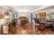 Open-concept living room with hardwood floors connecting the living, dining, and kitchen areas at 3504 Palace Ct, Tucker, GA 30084