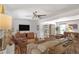 Spacious living room featuring hardwood floors, modern furniture, and a ceiling fan at 3504 Palace Ct, Tucker, GA 30084
