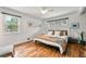 Main bedroom with hardwood floors, ceiling fan, ample natural light, and ensuite bathroom at 3504 Palace Ct, Tucker, GA 30084