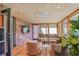 Cozy sunroom with brick wall, seating, and natural light at 3504 Palace Ct, Tucker, GA 30084