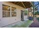 Exterior view of a back patio with AC unit, door, and multiple windows at 109 Bridlington St, Sugar Hill, GA 30518