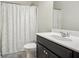 Bright bathroom with a shower and white patterned shower curtain at 109 Bridlington St, Sugar Hill, GA 30518