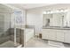 Bright bathroom featuring a glass-enclosed shower and soaking tub at 109 Bridlington St, Sugar Hill, GA 30518