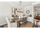 Bright dining room featuring hardwood floors and stylish lighting at 109 Bridlington St, Sugar Hill, GA 30518